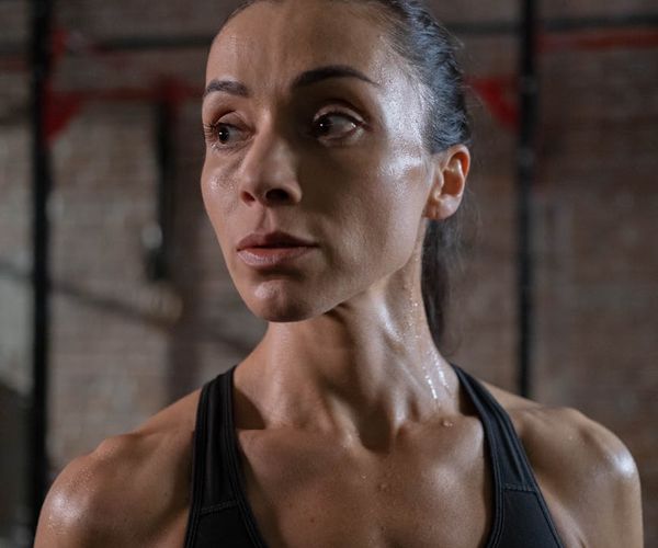 Close-up on a focused man's face during a workout.